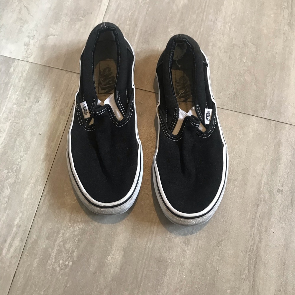 Vans black and white slip ons